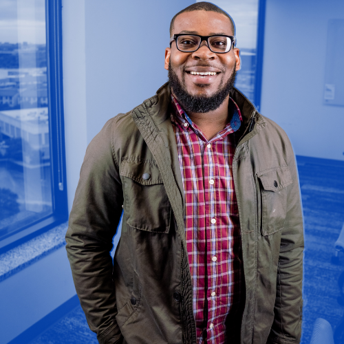 Man posing and smiling at camera.