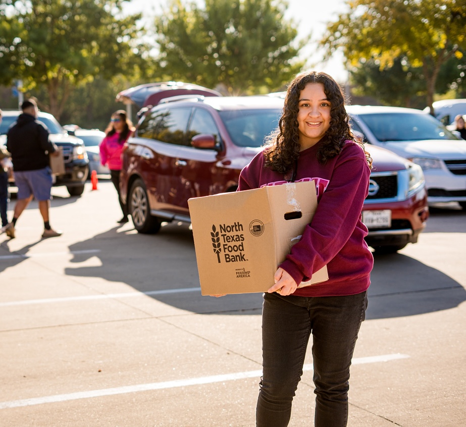 Young woman helping at food bank