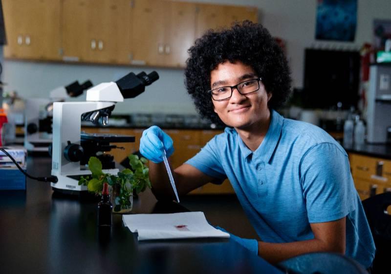 Myles Chung in a Biology Lab Conducting an Experiment