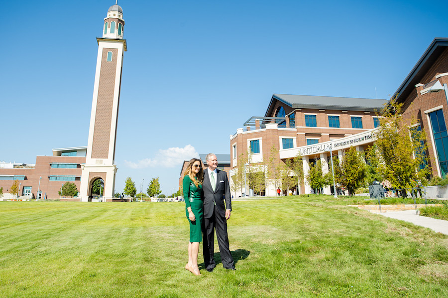 Mr. and Mrs. Ryan posing in front of tower