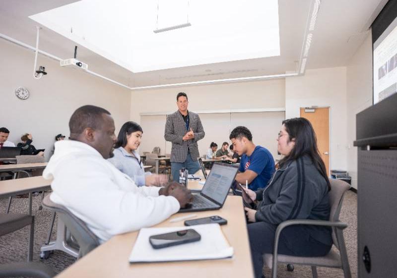 Business Students Engage with Their Professor During an Interactive Class Activity
