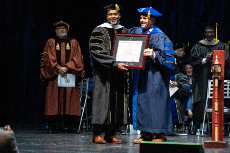 Roland Parrish Accepts an Honorary Doctorate Degree from UNT Dallas President Warren von Eschenbach