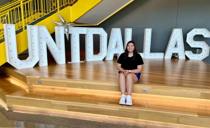 Maddie Mansell Sits in Front of the Letters That Represent Her Soon To Be Alma Mater
