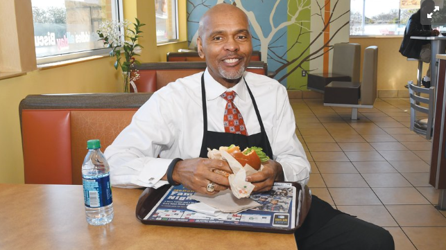 Roland Parrish Samples the Food at One of His McDonald's Franchises in North Texas (photo courtesy: Dallas Business Journal)