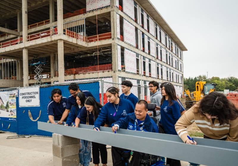 Students Sign the Final Steel Beam for the Topping Off Ceremony of the UNT Dallas STEM Building, Opening in Dec. 2025