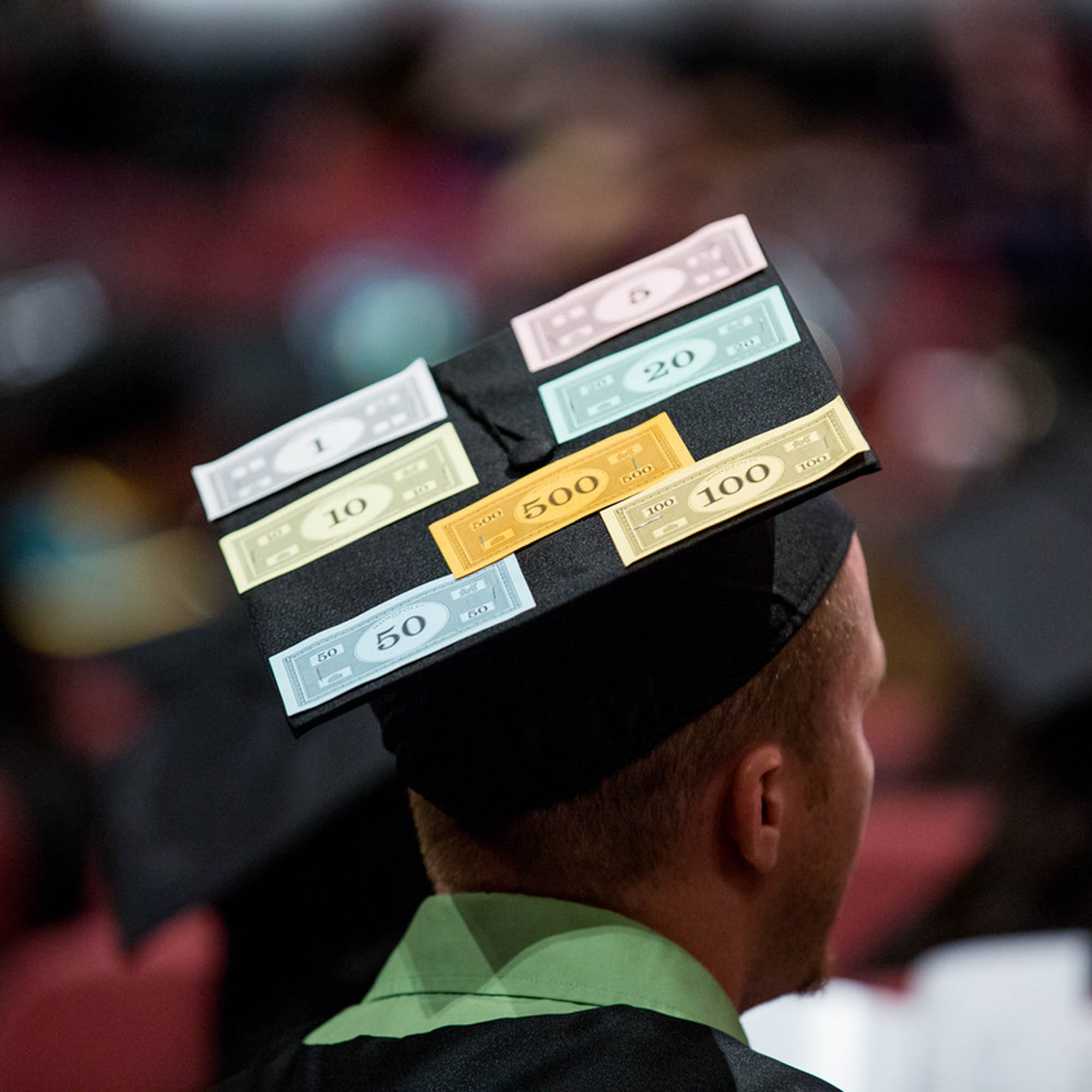 UNT Dallas Graduation cap with monopoly money on it