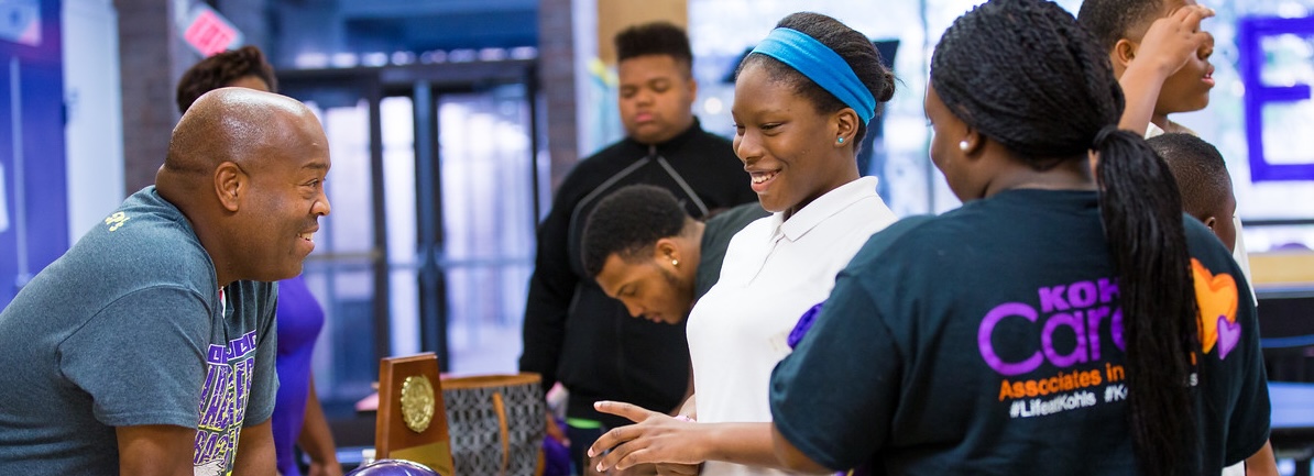 
high school students at recruitment table
