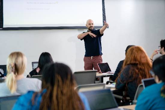professor at front of classroom teaching