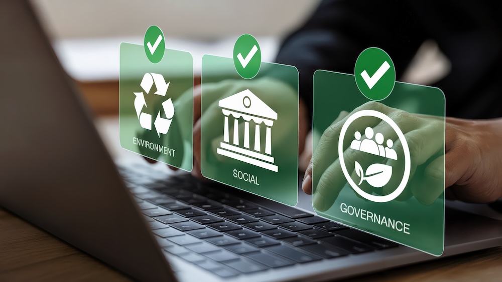 hands at keyboard, overlay text "environmental" "social" "governance"