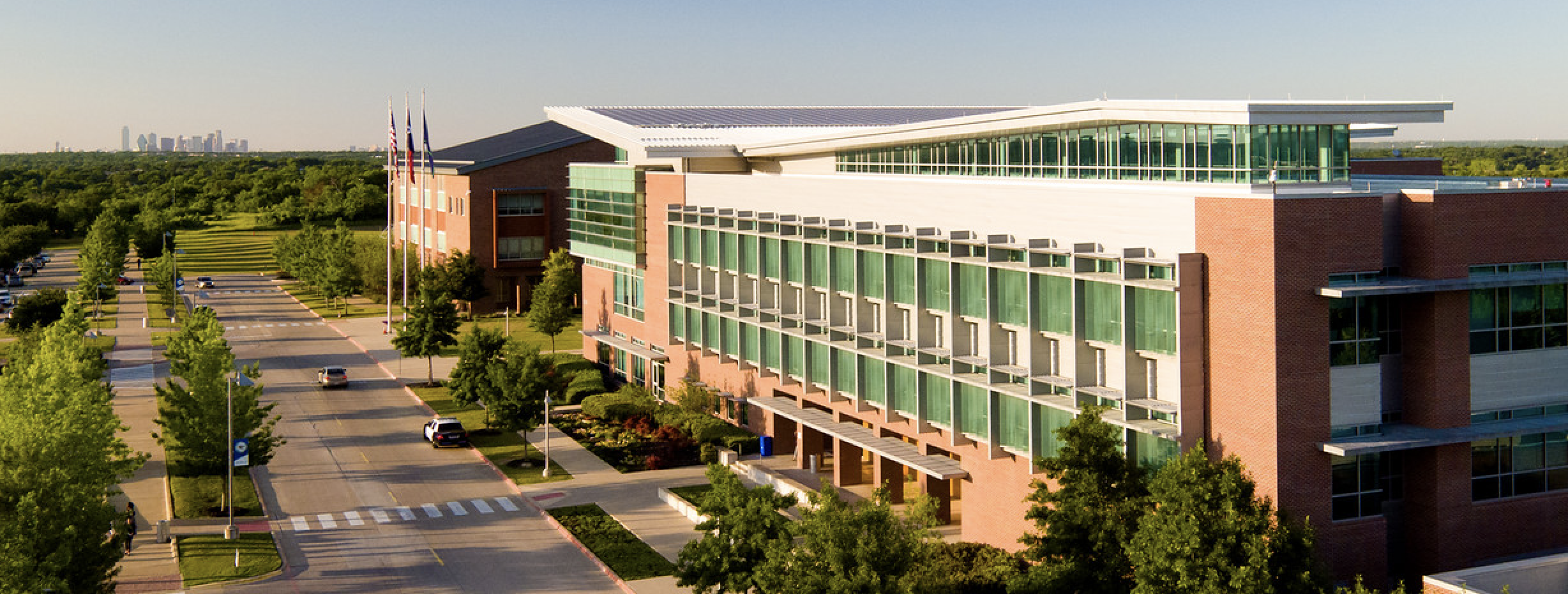 Image of UNT Dallas Campus with Dallas skyline in the distance