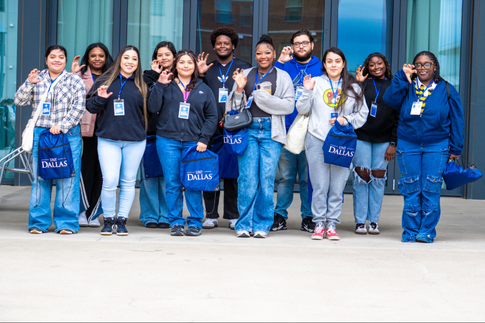Students smiling in a group photo.